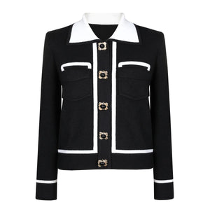 Black jacket with white collar and trim on a white background