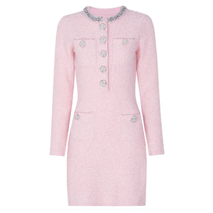 Pink coat with decorative buttons on a white background