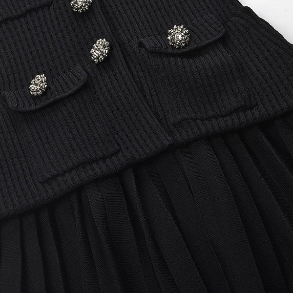 Black ribbed sweater with decorative buttons on a white background