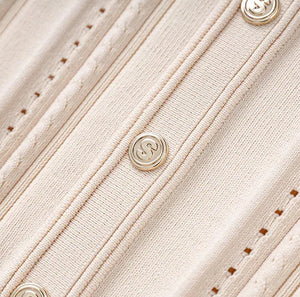 Close-up of a beige textured fabric with buttons