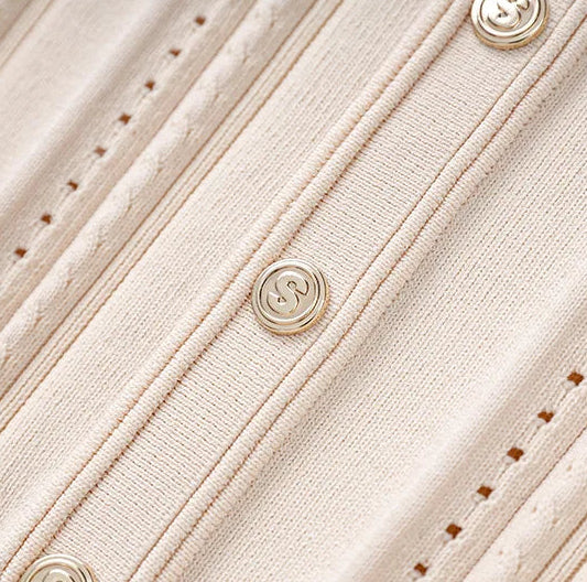 Close-up of a beige textured fabric with buttons