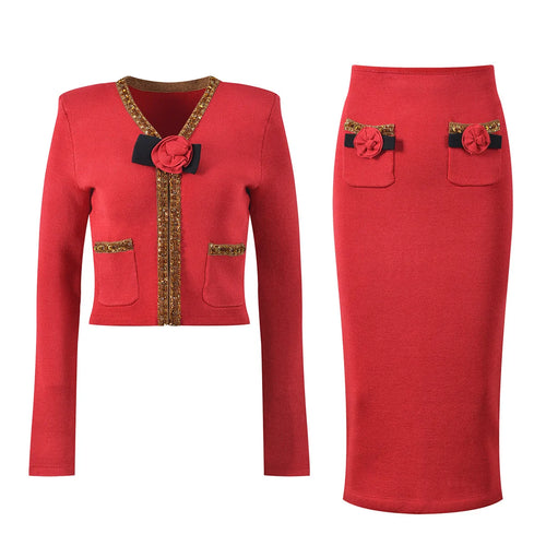 Red jacket and skirt set with decorative elements on a white background