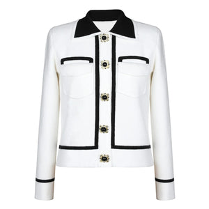 White jacket with black accents and decorative buttons on a white background