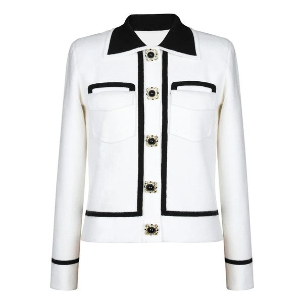 White jacket with black accents and decorative buttons on a white background