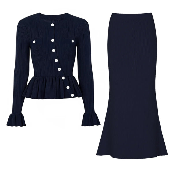 Navy blue ribbed long-sleeve top with white buttons and matching skirt on a white background
