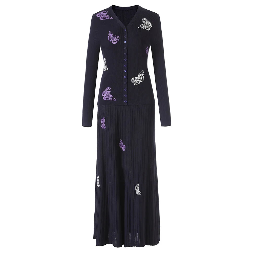 Black dress with purple floral embroidery on a white background