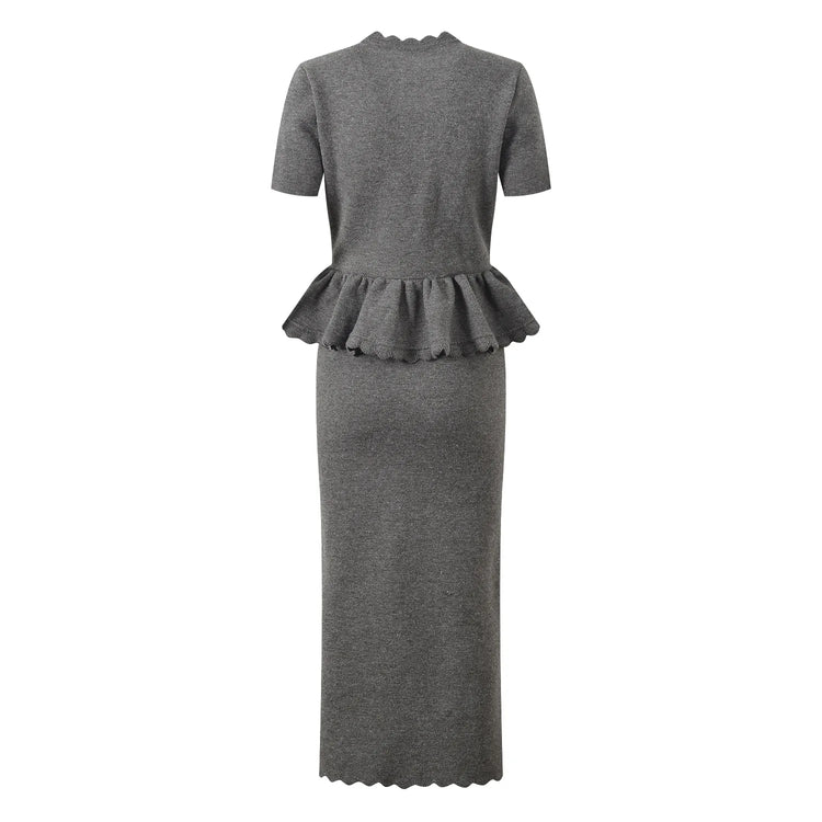 Gray dress with peplum detail on a white background