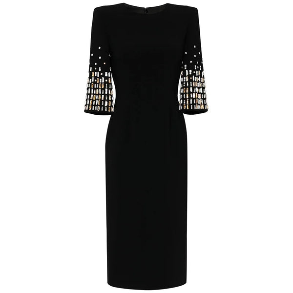Black dress with embellished sleeves on a white background