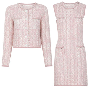 Pink textured jacket and dress set on a white background