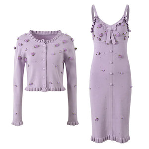 Lavender cardigan and dress set with floral embellishments on a white background