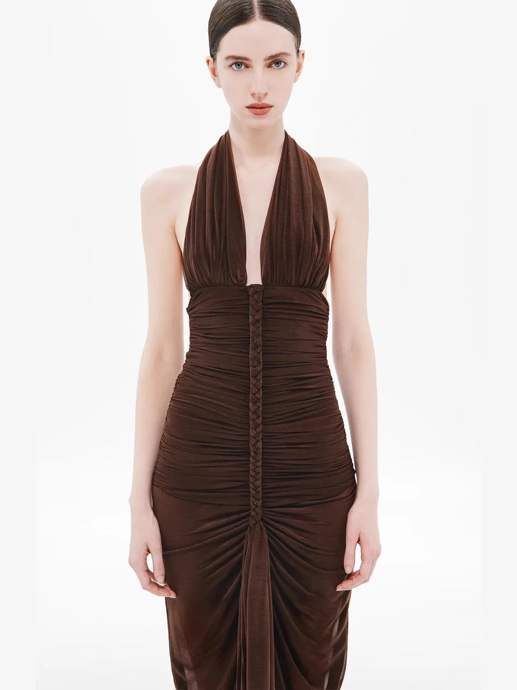 Woman wearing a brown evening gown on a white background