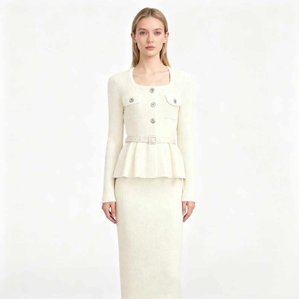 White ribbed knit jacket and skirt set on a white background