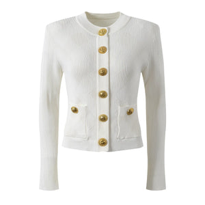 White cardigan with gold buttons on a white background