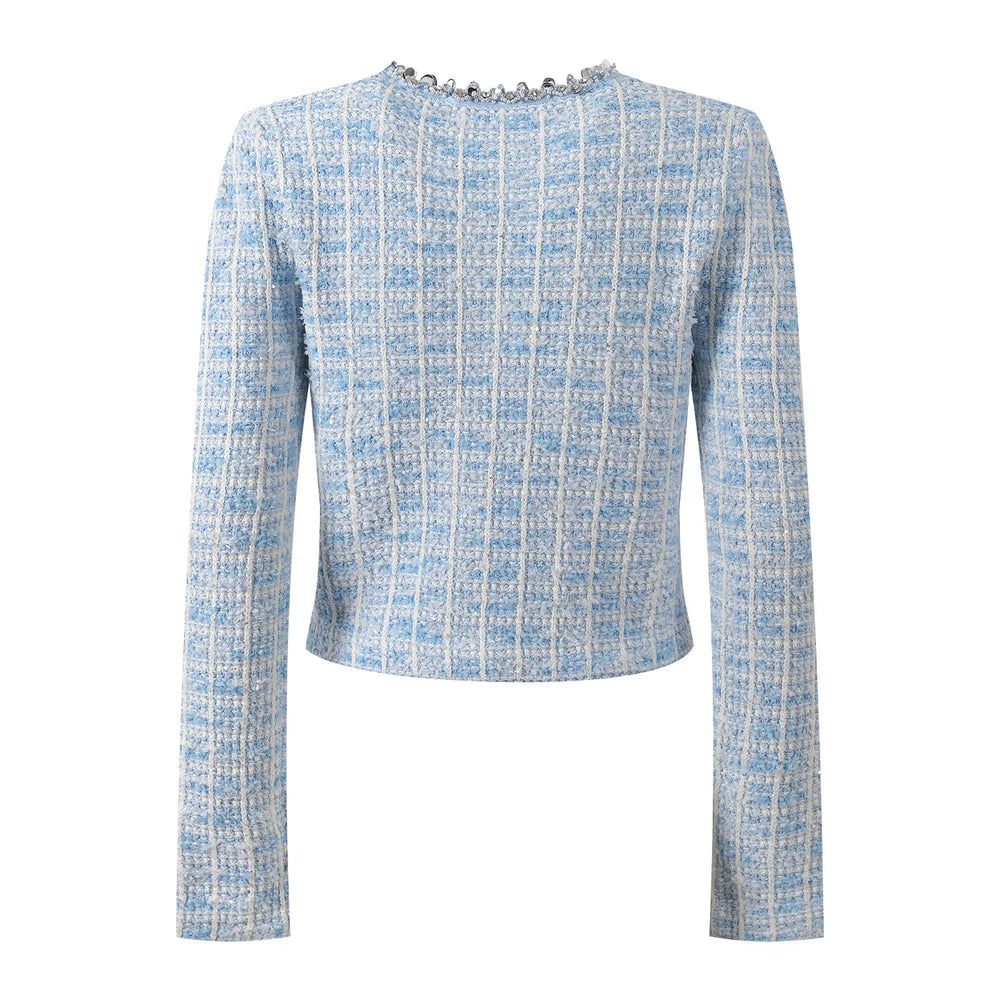 Light blue tweed jacket with decorative buttons on a white background