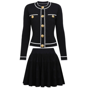 Black ribbed sweater with gold buttons and matching skirt on a white background