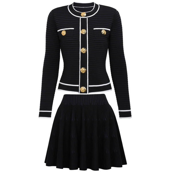 Black ribbed sweater with gold buttons and matching skirt on a white background