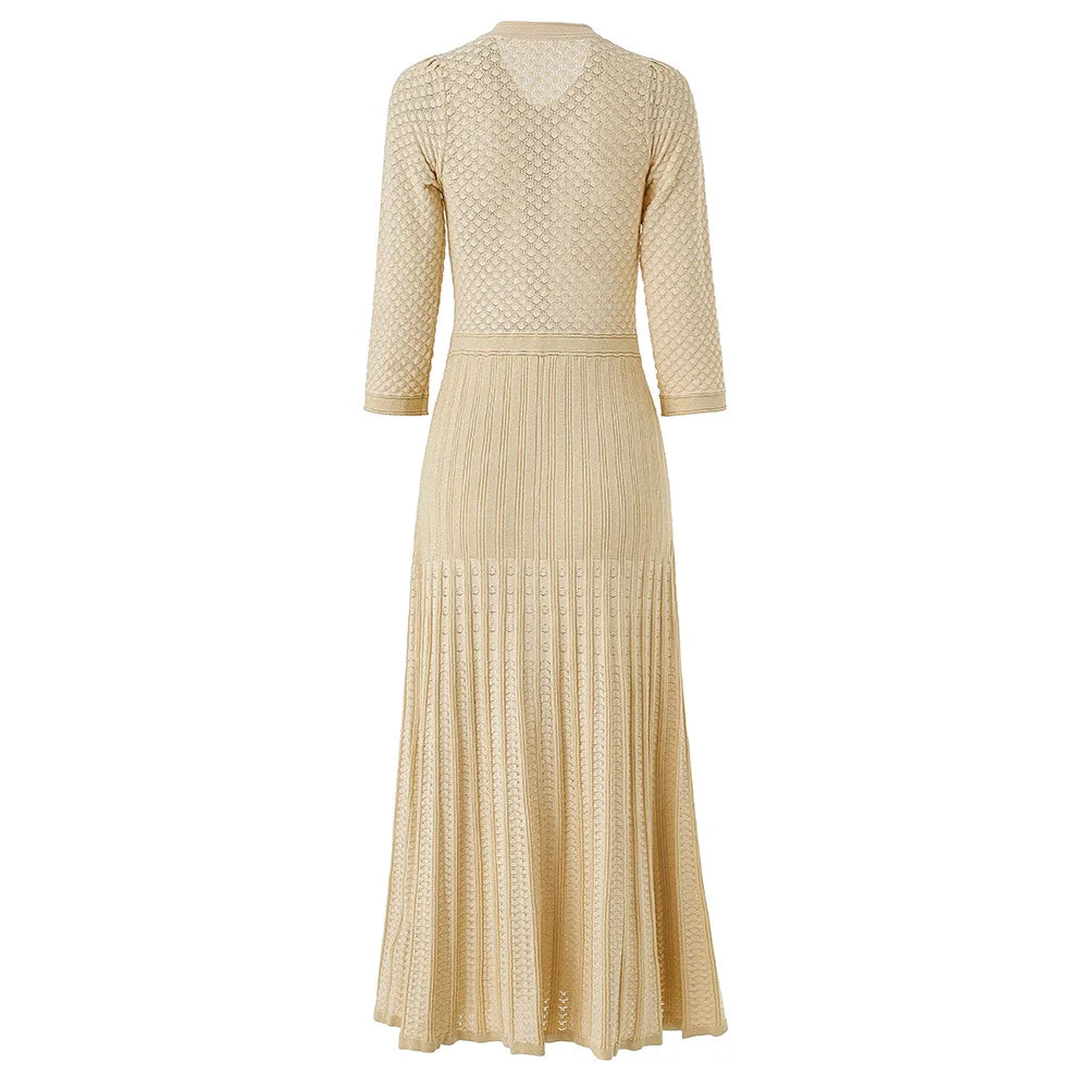 Beige dress with textured pattern and button details on a white background