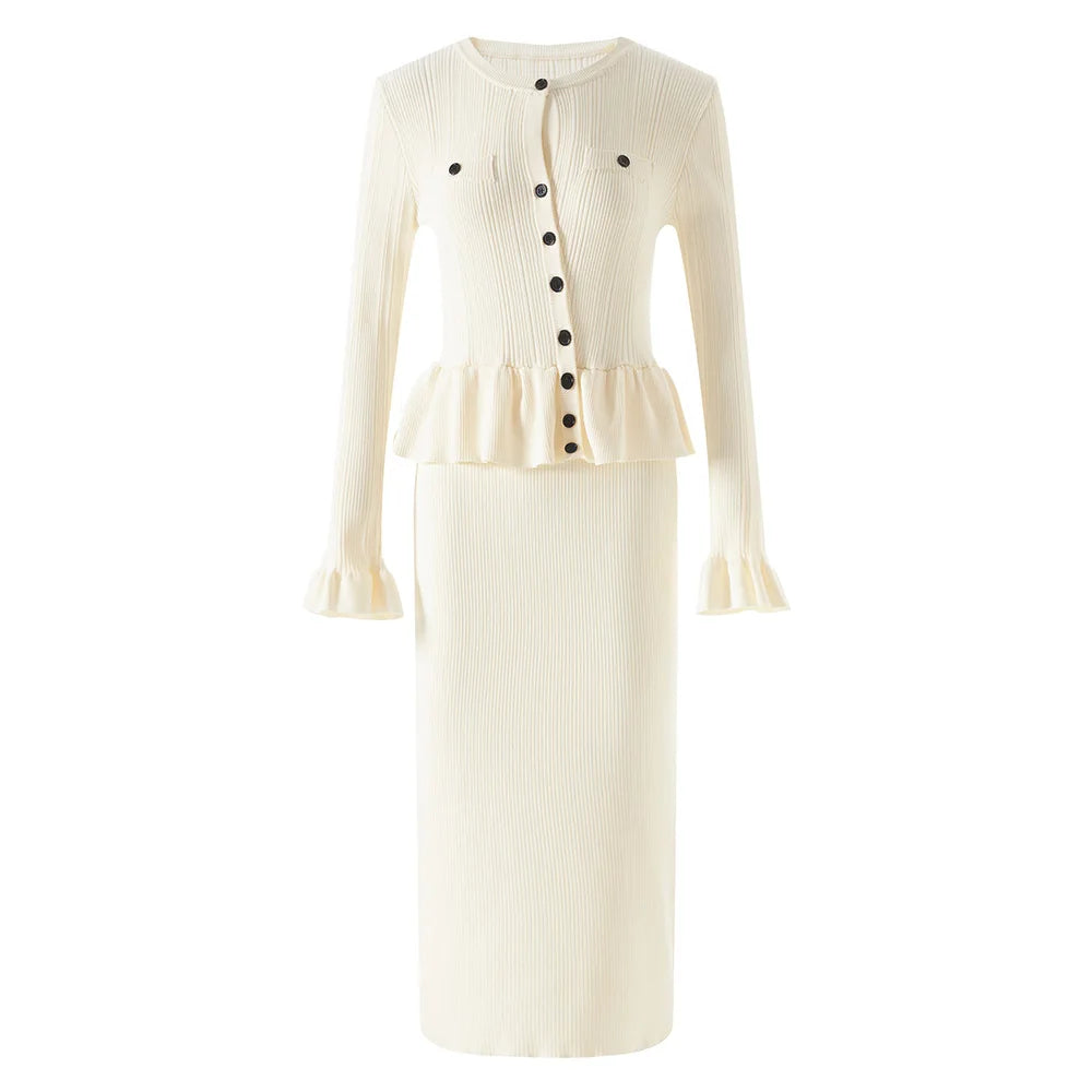 White ribbed dress with black buttons on a white background