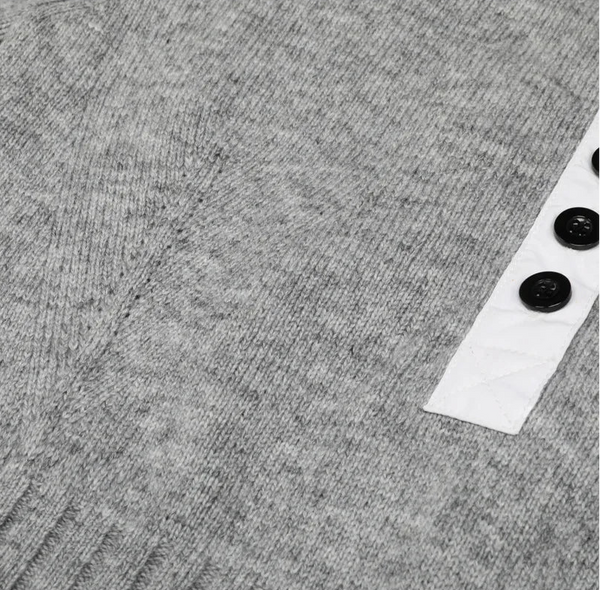 Gray textured fabric with buttons on a white background