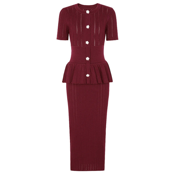 Maroon knit dress with peplum detail on a white background