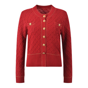 Red knitted cardigan with gold buttons on a white background