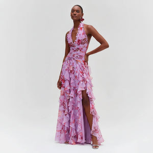 Woman wearing a pink floral dress on a white background