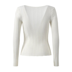 White ribbed long-sleeve top on a white background