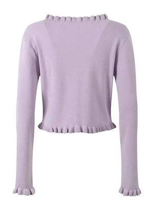 Light purple sweater with ruffled trim on a white background