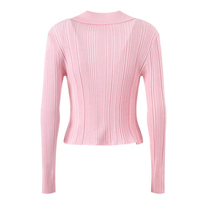 Pink ribbed long-sleeve top on a white background
