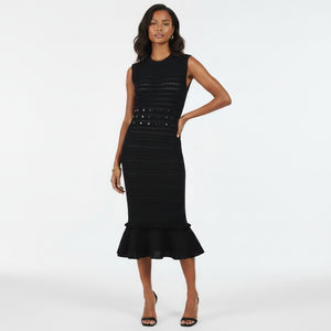 Black dress with ruffled hem on a white background