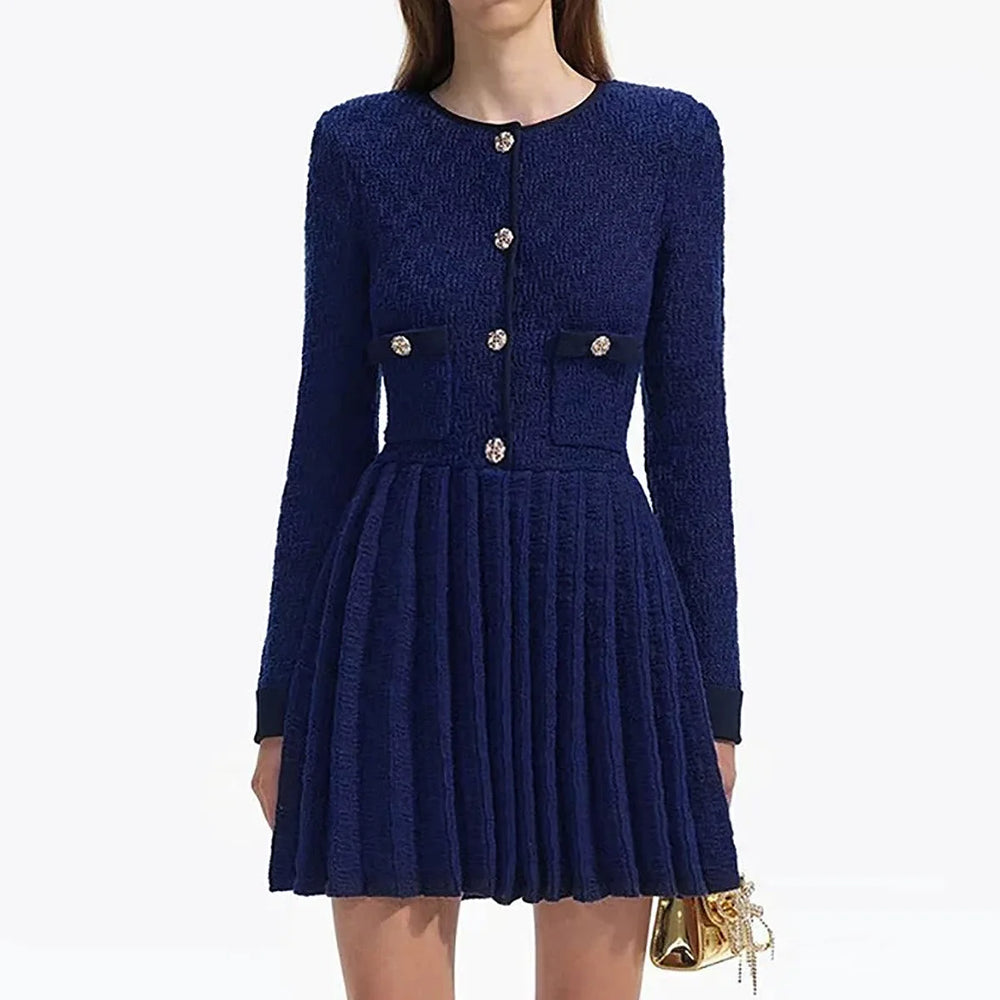 Navy blue dress with gold buttons on a white background