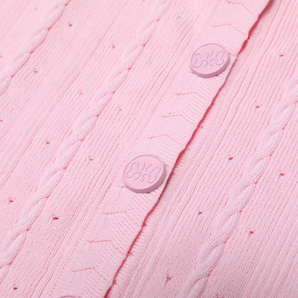 Close-up of a pink textured fabric with buttons, featuring the brand 'Cotter' on a pink background.