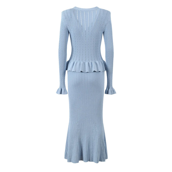 Light blue ribbed dress with peplum waist on a white background