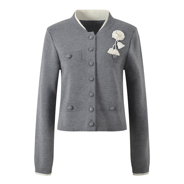 Gray cardigan with floral embellishment on a white background