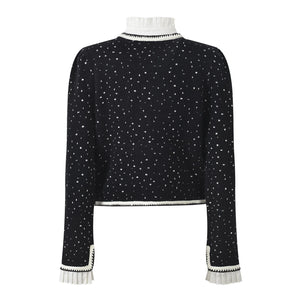 Black sweater with white star pattern on a white background