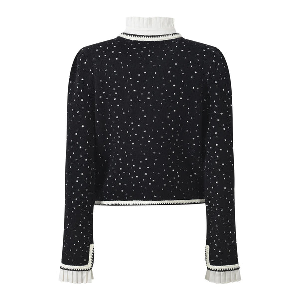 Black sweater with white star pattern on a white background
