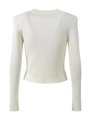 White ribbed long-sleeve top on a white background