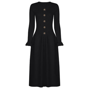 Black dress with gold buttons on a white background