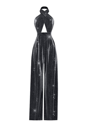 A black halter-neck jumpsuit with a high-waisted, wide-leg silhouette, featuring a textured, shimmering fabric with a starry cosmic print on a white background.