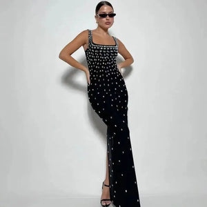 Get ready to shine in our Black Skyblue Bodycon Dress! With a sexy O-neck and shimmering crystal details, this sleeveless dress will turn heads at any nightclub or p