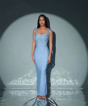 Get ready to shine in our Black Skyblue Bodycon Dress! With a sexy O-neck and shimmering crystal details, this sleeveless dress will turn heads at any nightclub or p