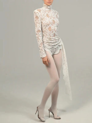 Elevate your style with our Draped Lace Bodysuit. This sophisticated and exclusive piece features intricate lace and a flattering draped design. Perfect for your nex