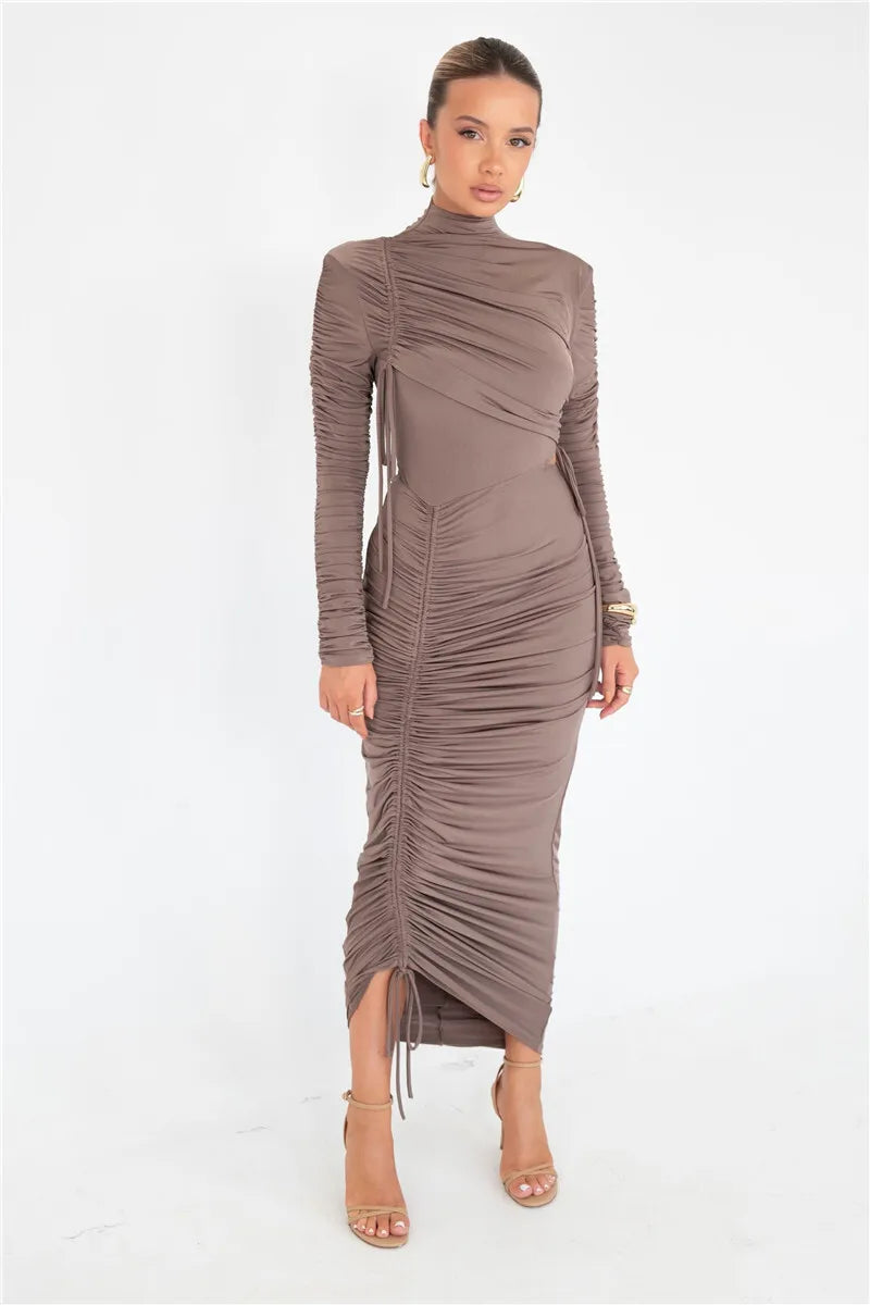 Experience elegance and luxury in our Valerie Long Sleeve Maxi Dress. Designed for the sophisticated woman, this dress features a drawstring turtleneck and ruched de