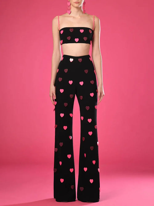 Unleash your inner fashionista in this sexy and playful set! The New Spring Women's set includes a sleeveless top adorned with sparkling sequins in the shape of hear