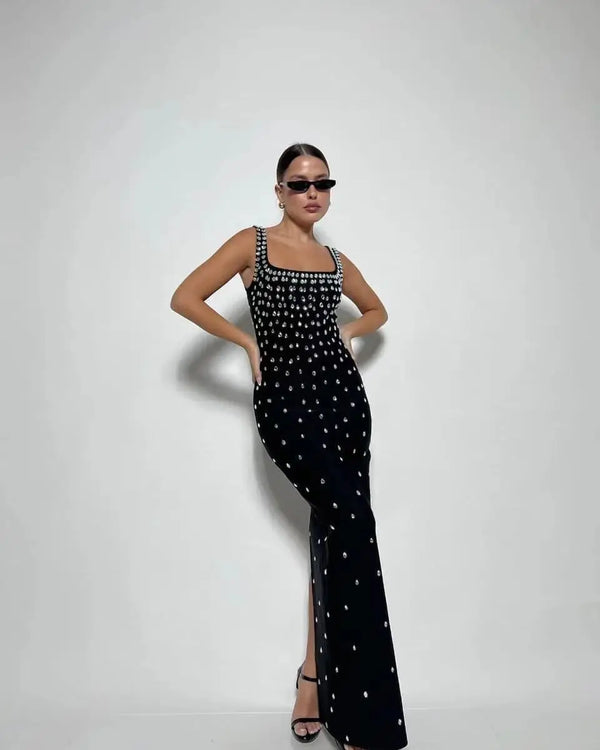 Get ready to shine in our Black Skyblue Bodycon Dress! With a sexy O-neck and shimmering crystal details, this sleeveless dress will turn heads at any nightclub or p