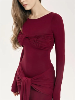 Become a trendsetter with our Oslo Maxi Dress! This bold and adventurous dress features a unique patchwork twist design, flattering slim fit, and long sleeves for a 