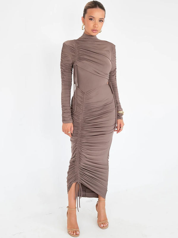 Experience elegance and luxury in our Valerie Long Sleeve Maxi Dress. Designed for the sophisticated woman, this dress features a drawstring turtleneck and ruched de