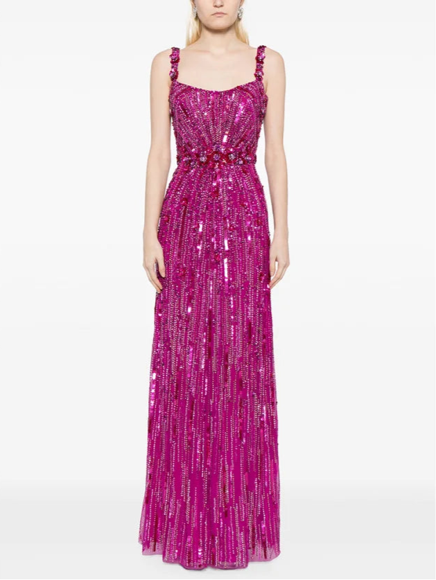 Woman wearing a pink sequin dress on a white background