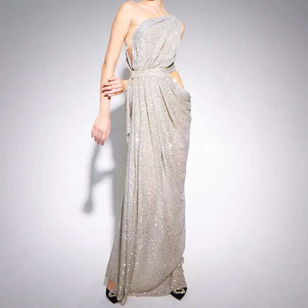Silver sequin evening gown on a plain background