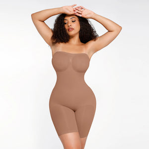 Woman wearing a beige shapewear bodysuit on a white background